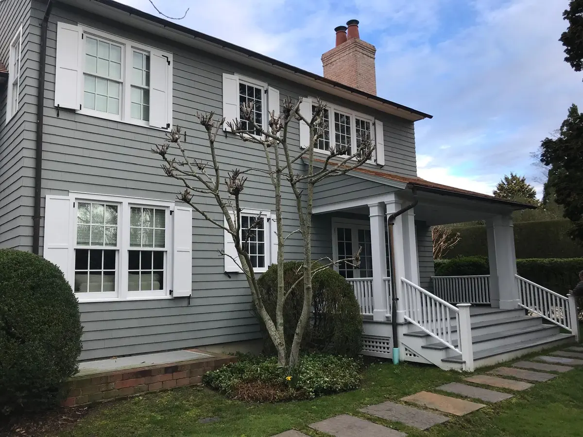 Gray exterior paint with white trim and shutters